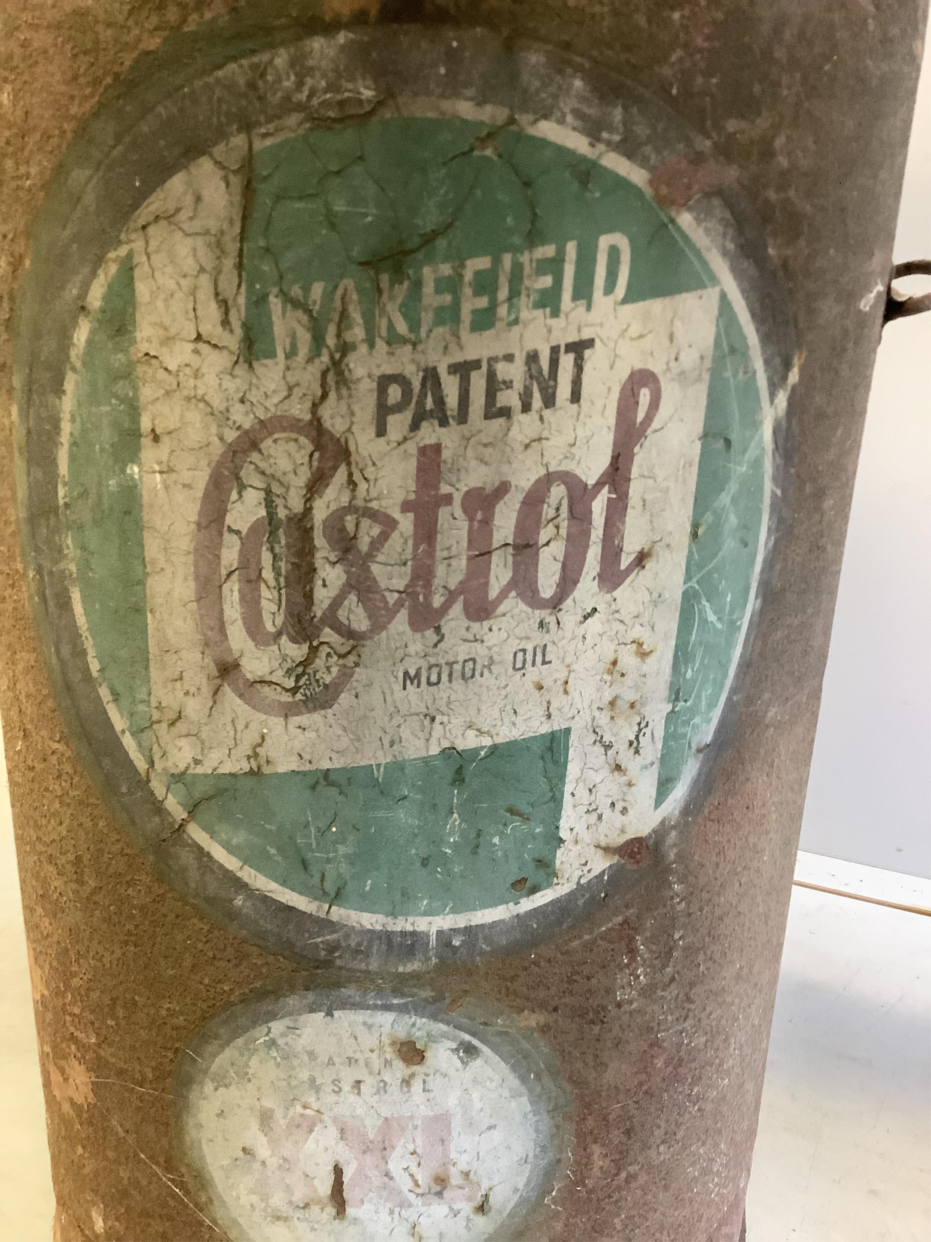 A large vintage Castrol oil dispensing drum, height 88cm. Condition - poor to fair